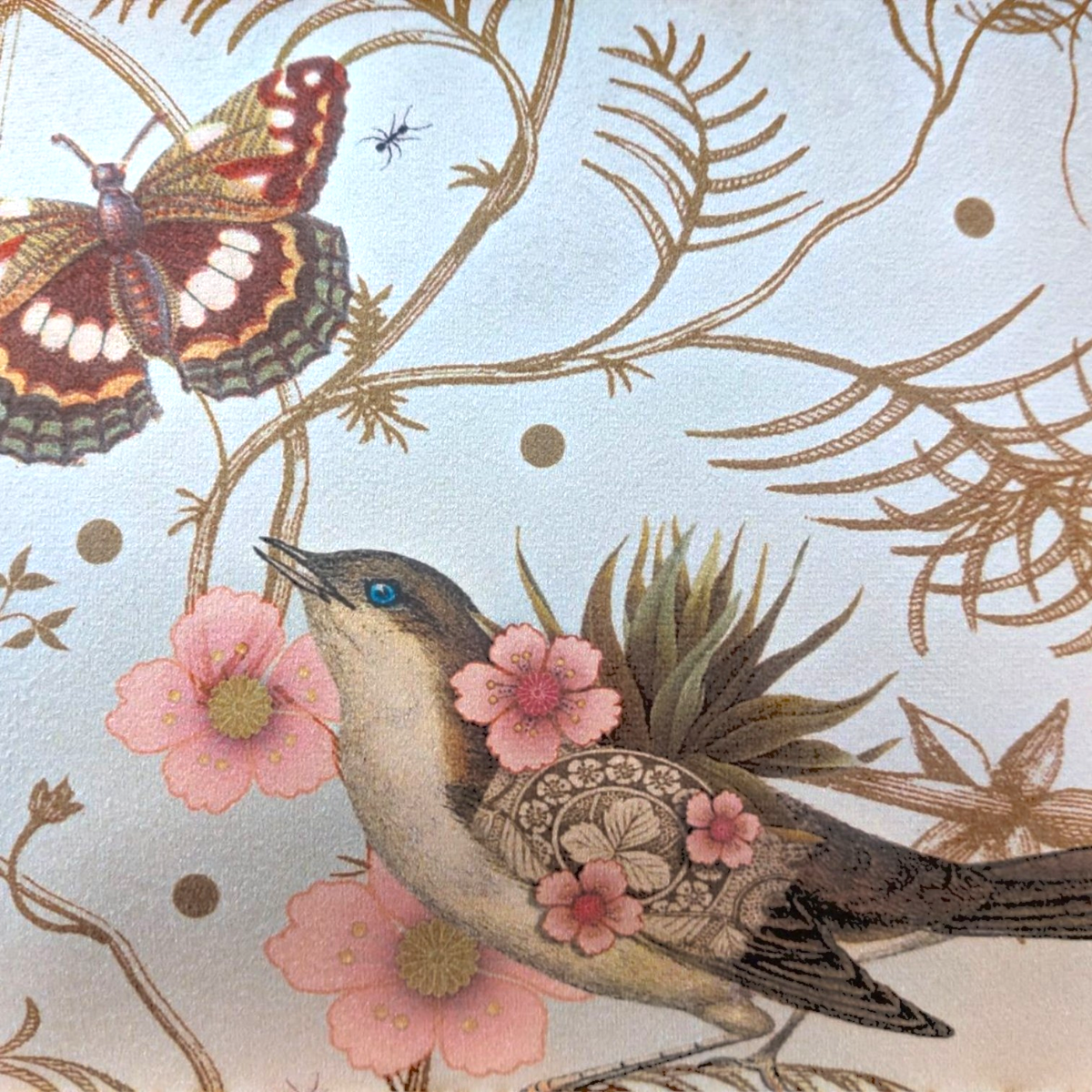 Depuis des lustres velvet cushion featuring a botanical print with a butterfly, bird, and golden branches.