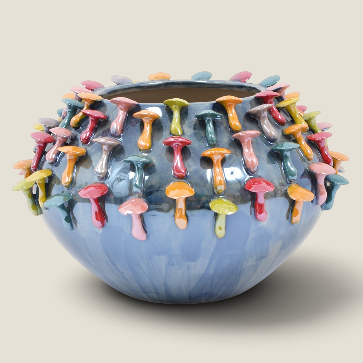 Depuis des lustres DRIMMER AURIELA ceramic bowl vase with deep blue glaze and colorful 3D mushroom-shaped reliefs.