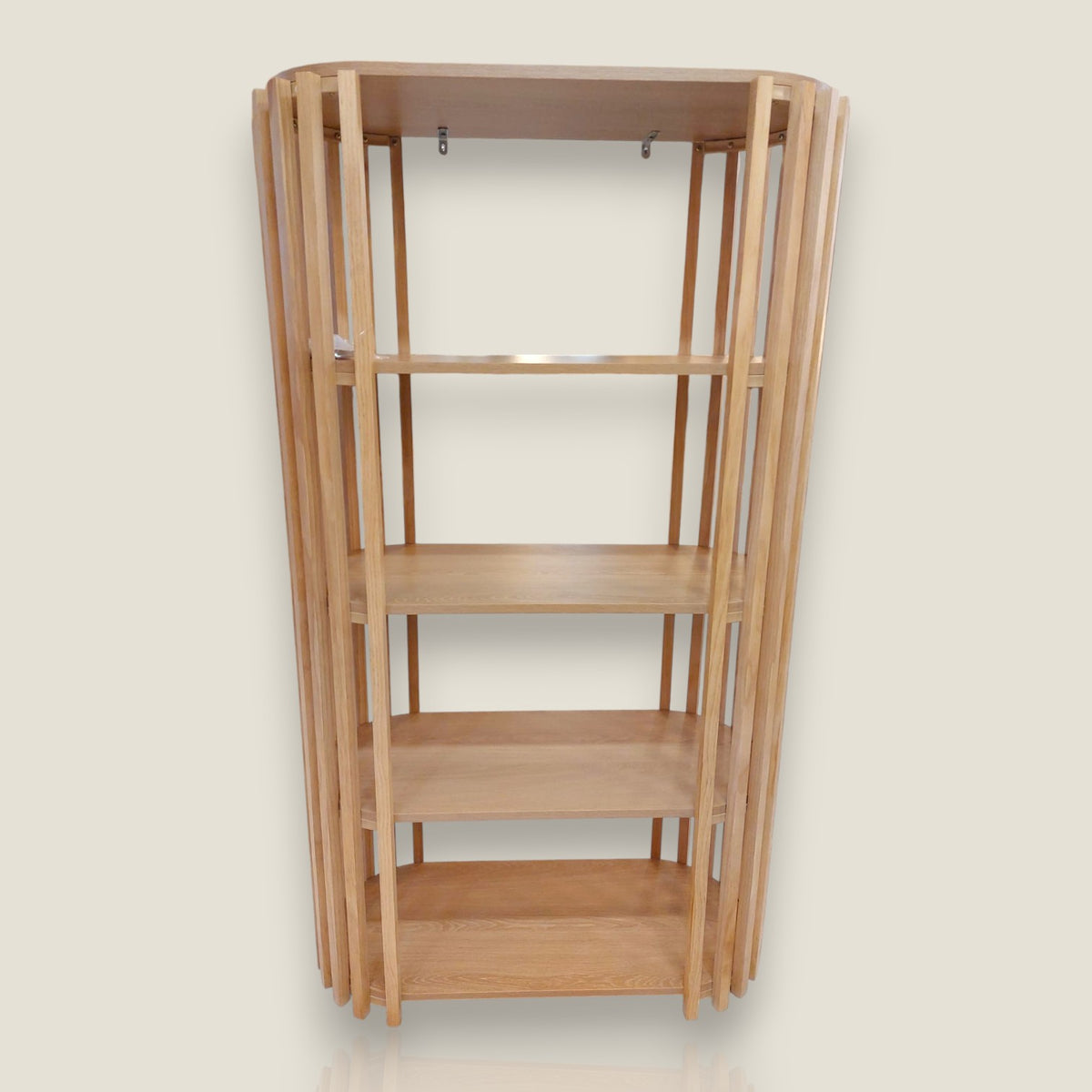 Depuis des lustres oval wooden shelving unit with slatted vertical supports and four tiers for contemporary storage.