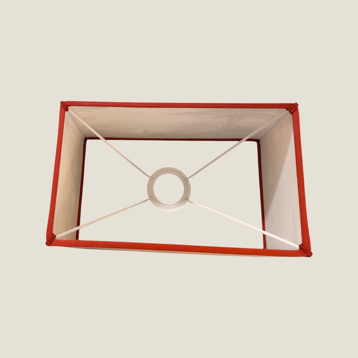 Depuis des lustres rectangular lampshade with Naple print, brick red cotton trim, and white E27 metal frame top view.