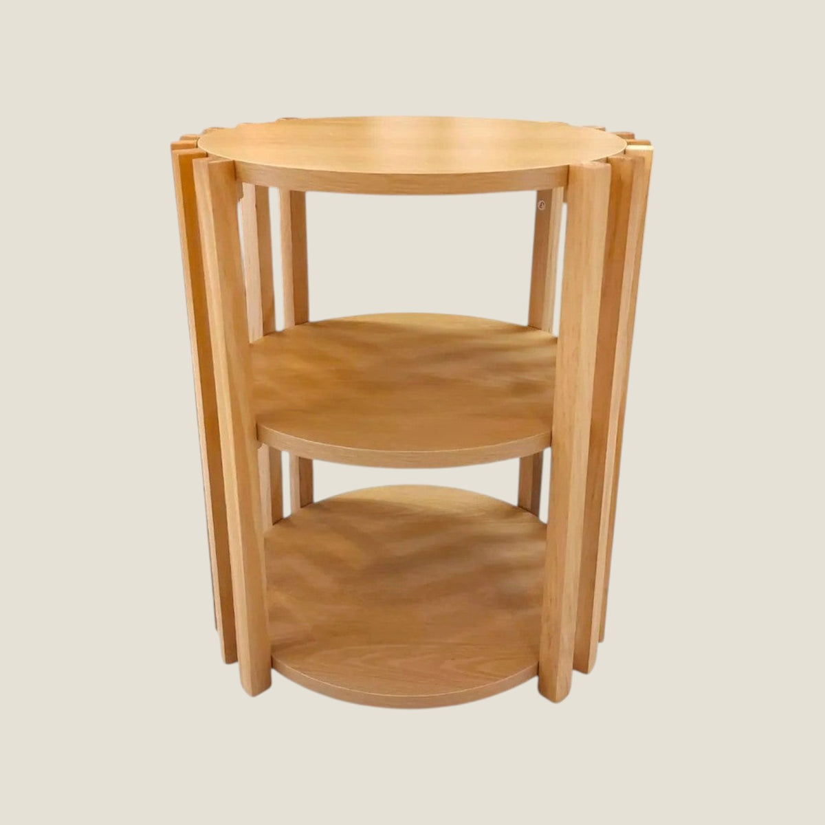 Depuis des lustres round side table with three natural wood tiers and a minimalist slatted frame design