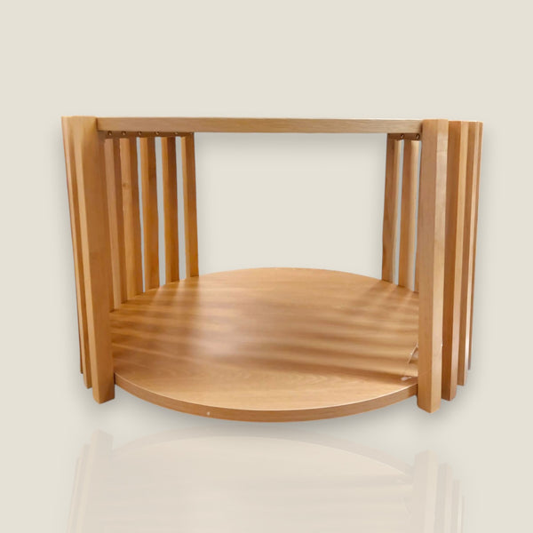Depuis des lustres EDELWEIS round solid wood side table with vertical slat design and a lower storage shelf.