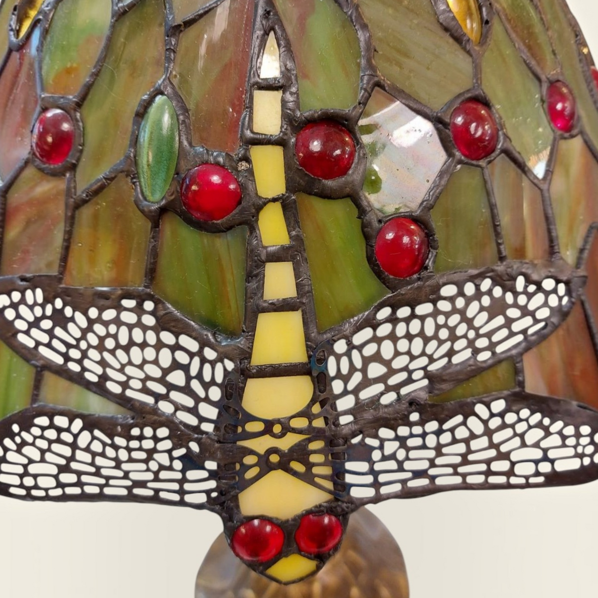 Depuis des lustres Tiffany style dragonfly stained glass lamp with green, yellow, and red glass cabochon details.