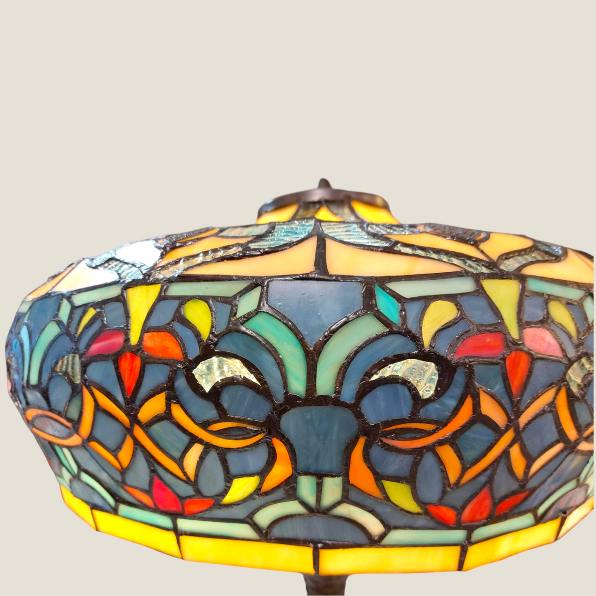 Depuis des lustres Tiffany style stained glass lamp shade with blue, orange, and yellow floral patterns and leaded glass