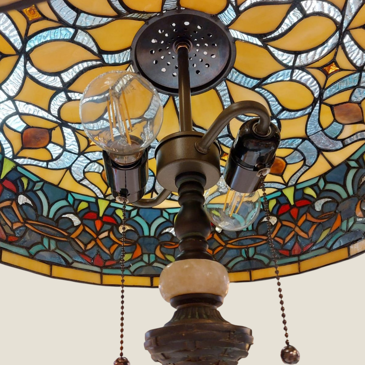 Depuis des lustres Tiffany style stained glass lamp shade with floral patterns and bronze hardware details