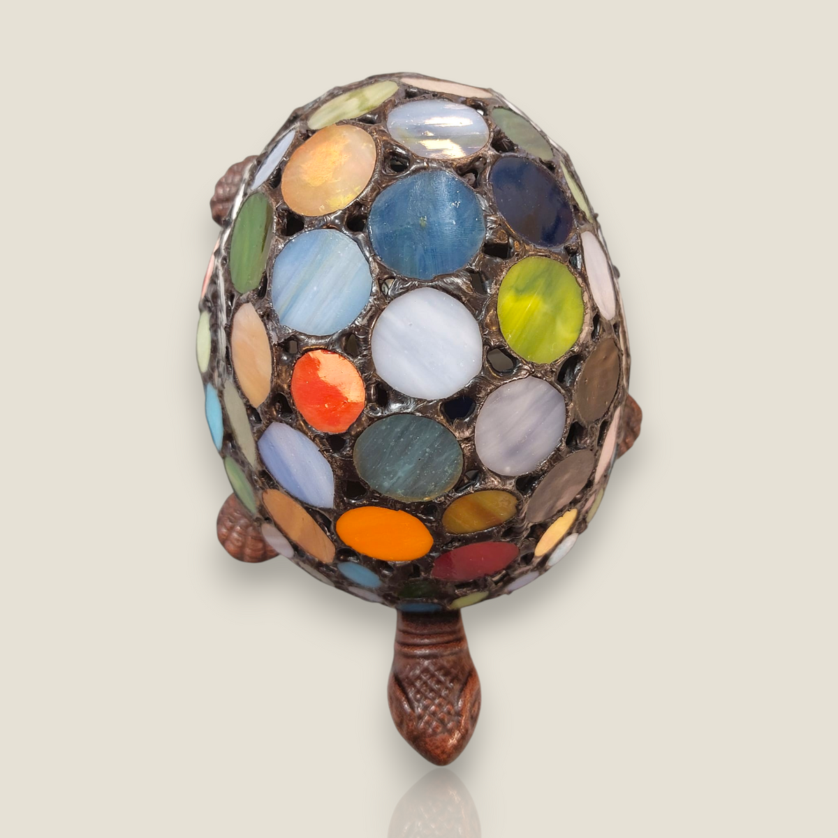 Depuis des lustres Tiffany style turtle lamp with a colorful stained glass shell and bronze-toned resin body.
