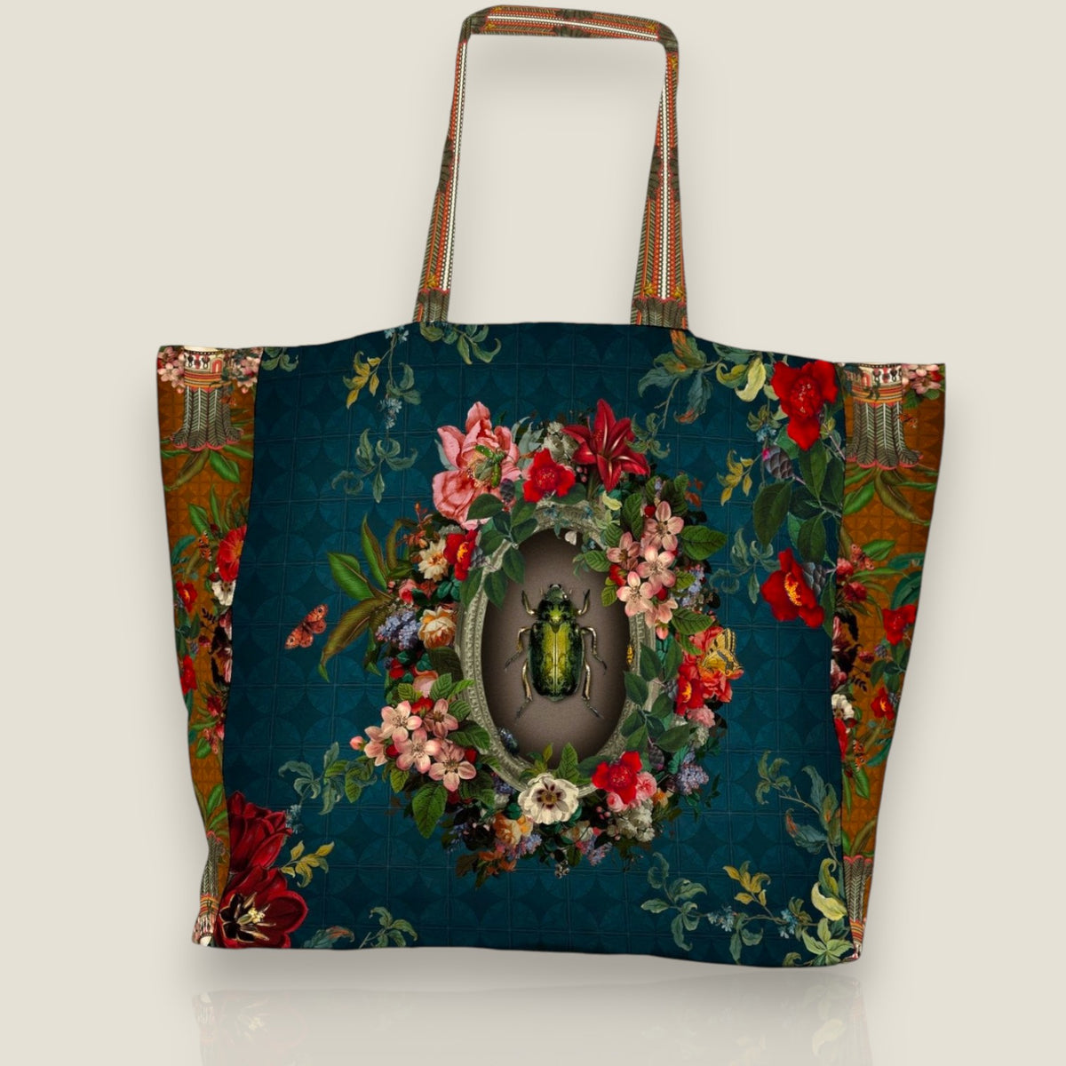 Depuis des lustres Voglio Bene tote bag with beetle, floral medallion, and peacock blue baroque print on polyester.
