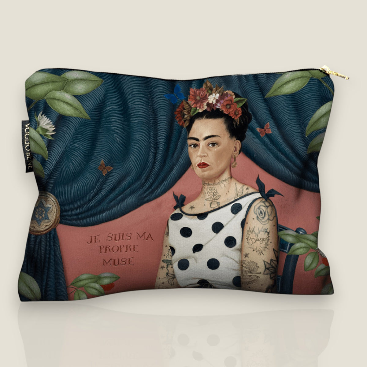 Depuis des lustres Voglio Bene velvet pouch featuring a tattooed woman portrait, blue curtain, and polka dot trim.