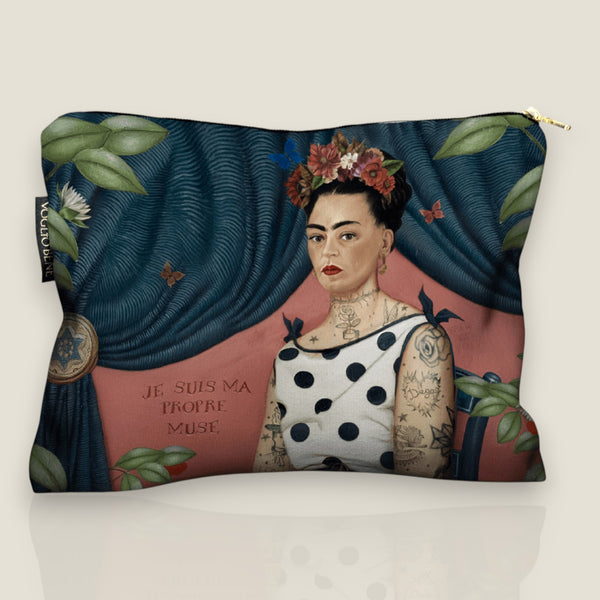 Depuis des lustres Voglio Bene velvet pouch featuring a tattooed woman portrait, blue curtain, and polka dot trim.