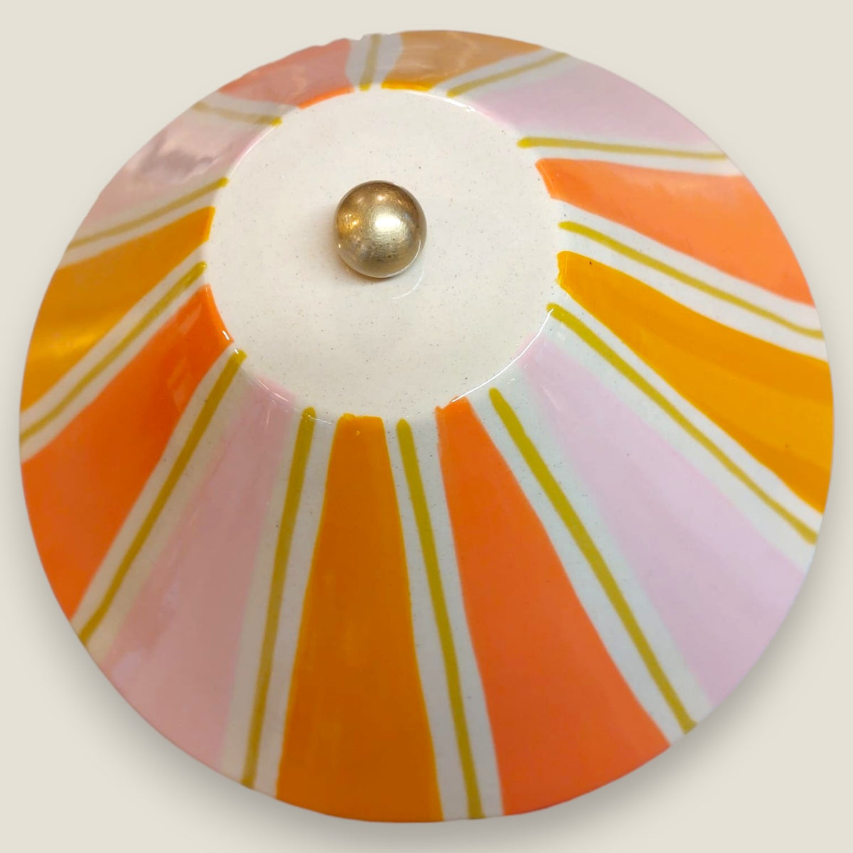 Depuis des lustres Zélie table lamp top view featuring a conical ceramic shade with pink, orange, and gold stripes.